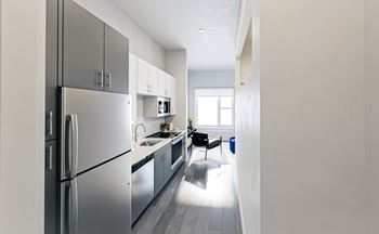 Kitchen and hall way at Link Apartments® Broad Ave, Memphis, Tennessee